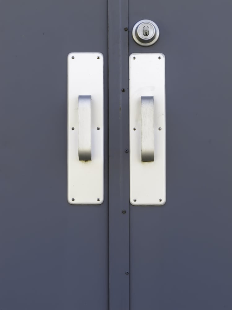 Pair of silver doorhandles and keylock on exterior metallic door-1