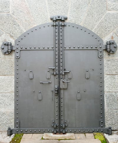 steel door inset on concrete wall