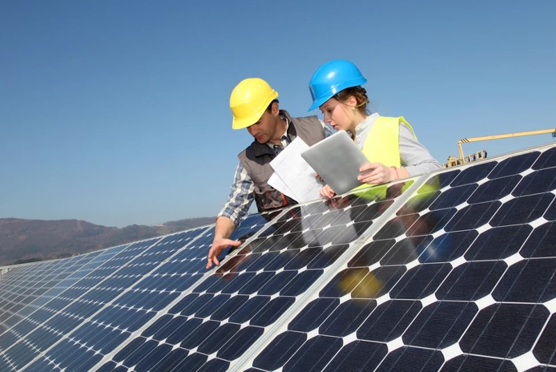 Solar Panel Mounting, workers examining solar panels