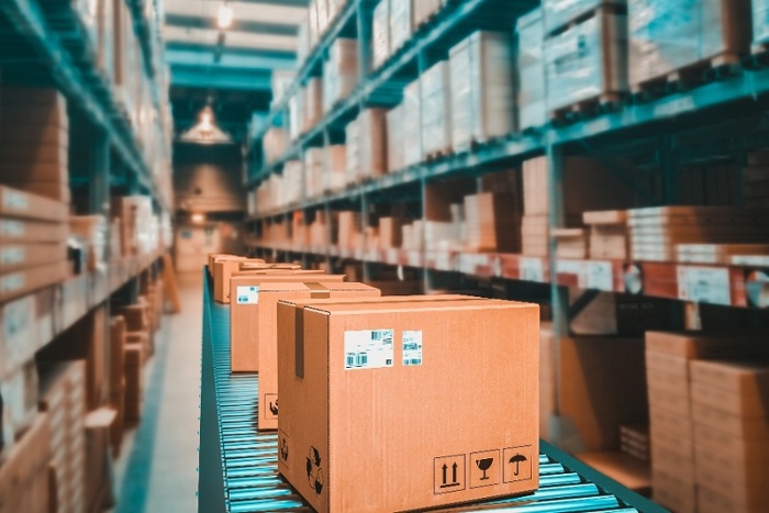 Boxes on a warehouse conveyor. Consider Roll Forming For Warehouse Storage Racks and Conveyors